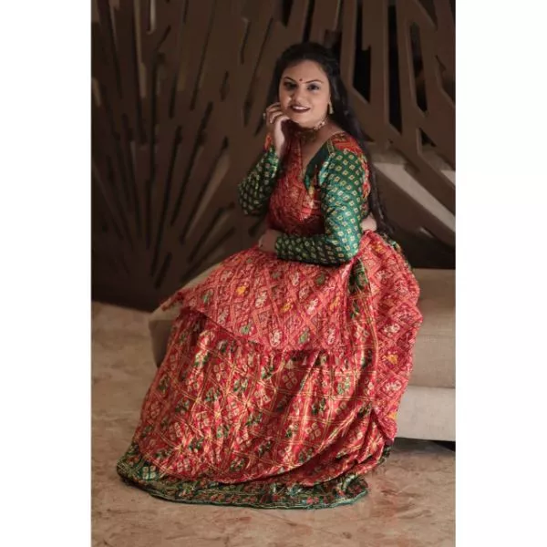 "Vibrant Elegance: Red & Green Bandhani Choli With Lehenga for Rent" on rent